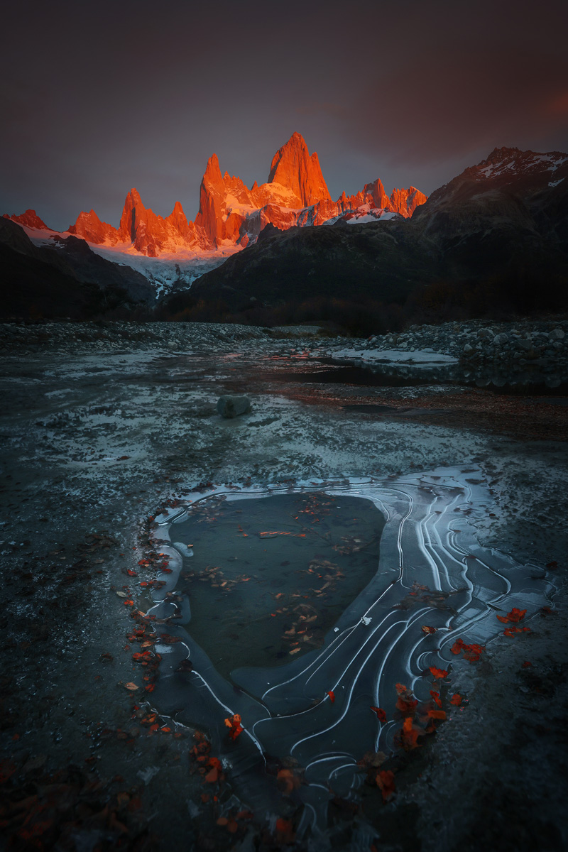 color landscape photo of frozen lake and mountain by Debojyoti Lahiri